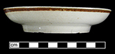 Saucer with brown iron oxide exterior rim glazing from 18CV60.